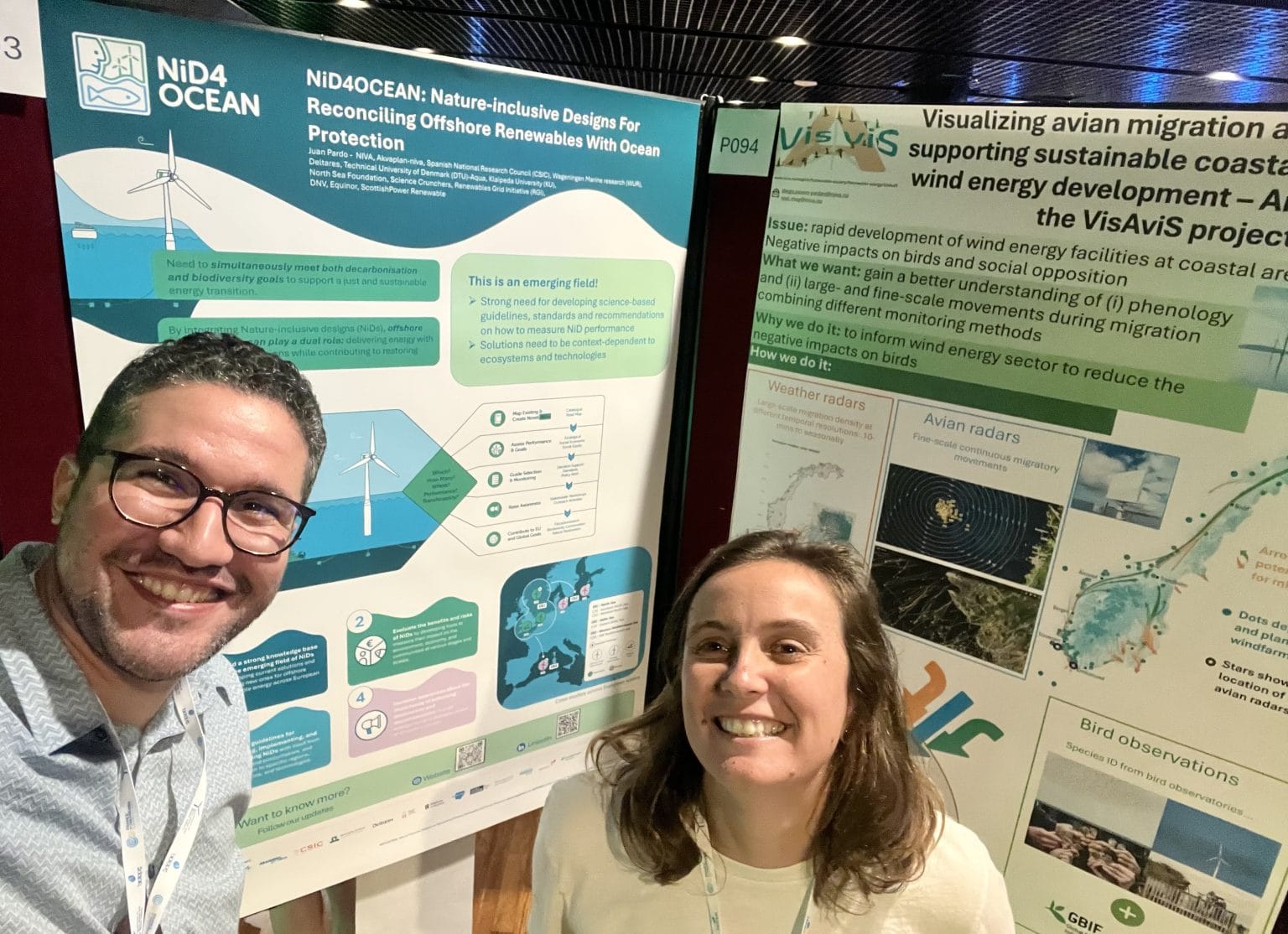 Two people, Juan Pardo (from NIVA), and Clémentine Mitoyen (from CSIC) in front of their congress posters at the CWW25